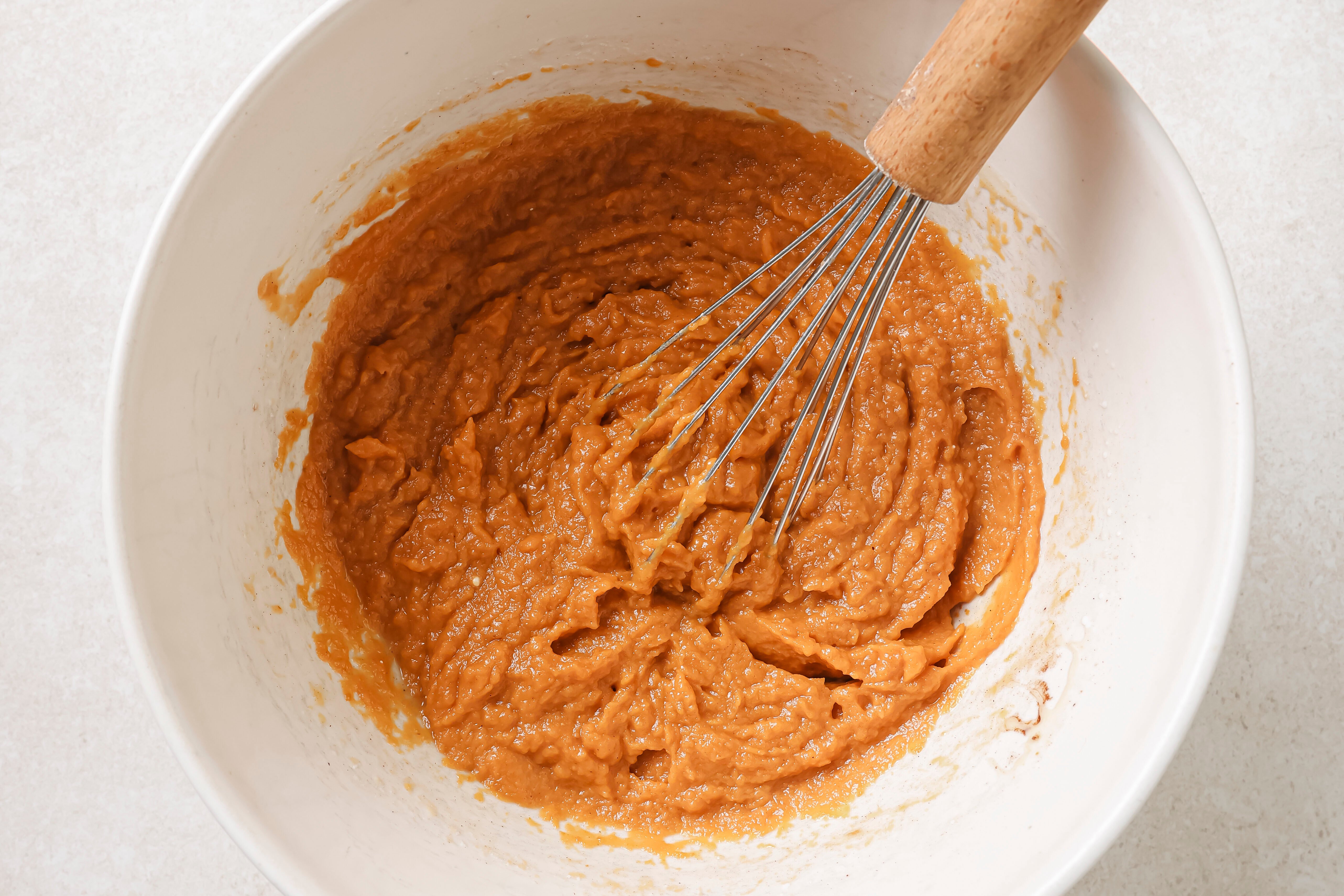 Pumpkin pie bar ingredients for the filling in a bowl, fully whisked. 