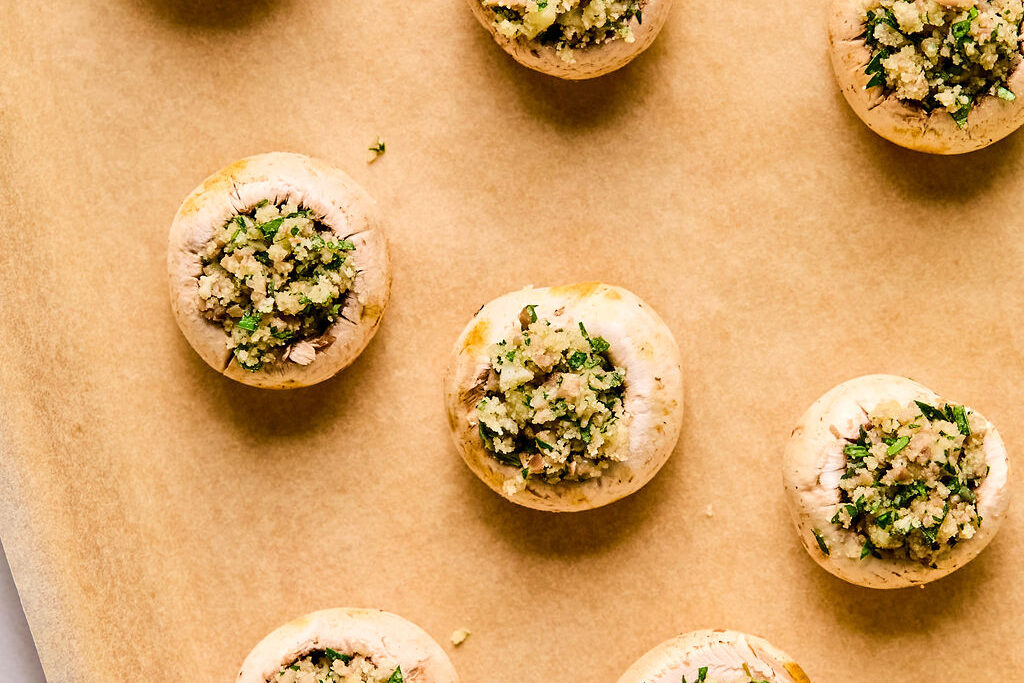 Mushroom caps stuffed and ready to go in the oven.