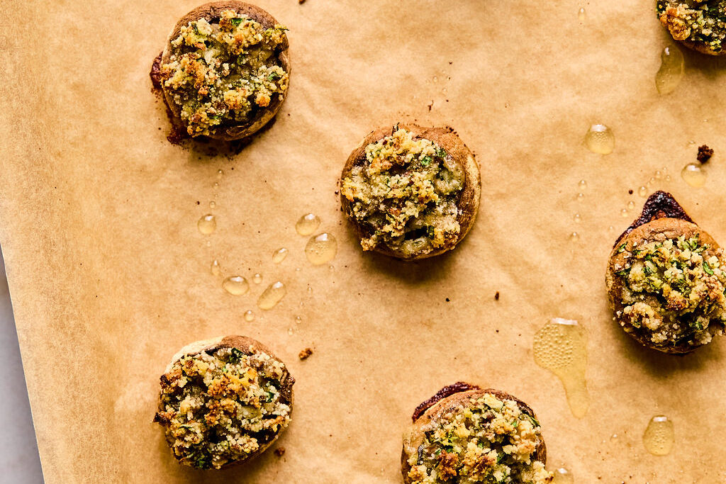 A baking sheet with mushroom caps after baking.