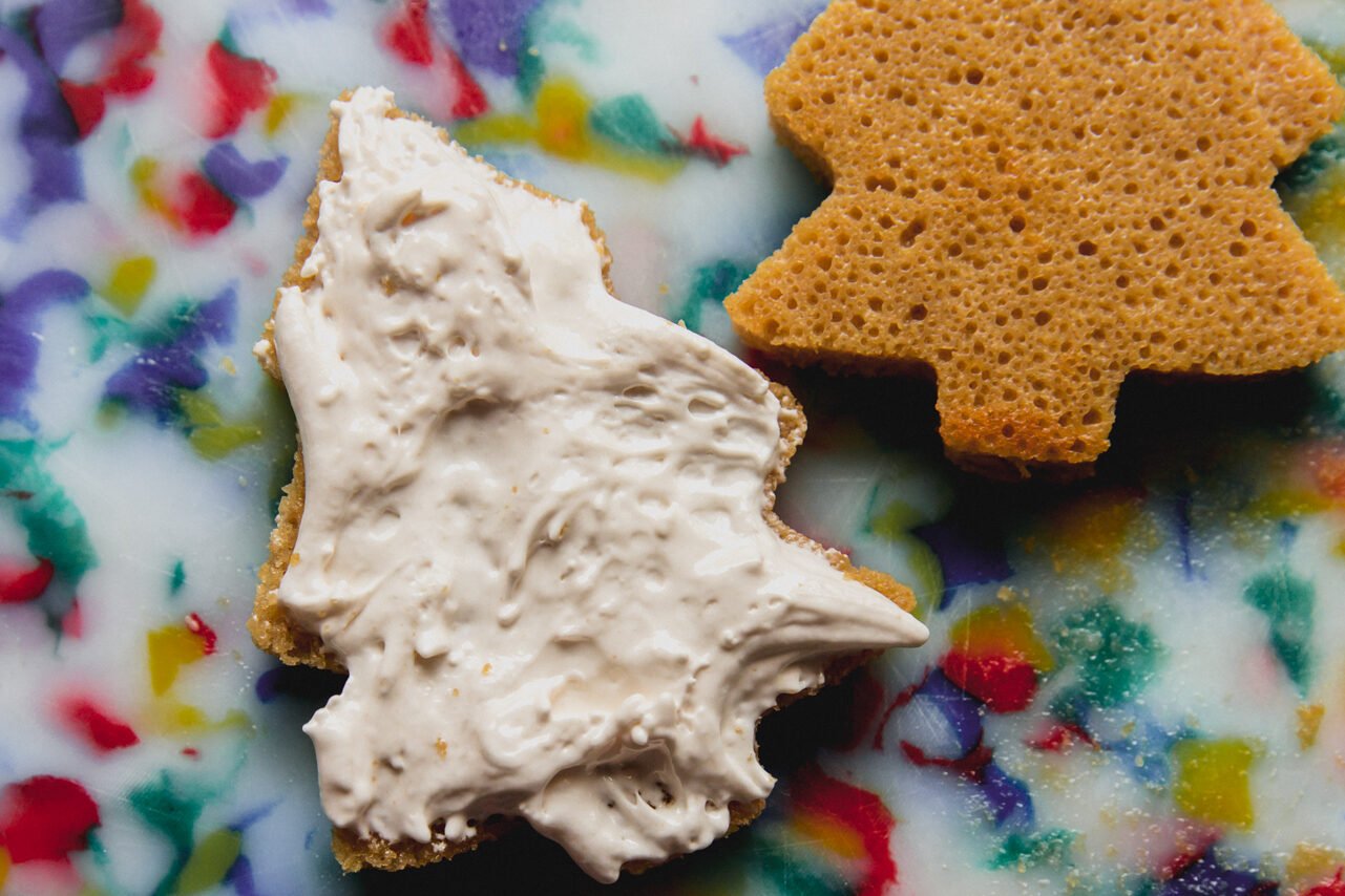 Christmas tree cakes with one topped with marshmallow cream.