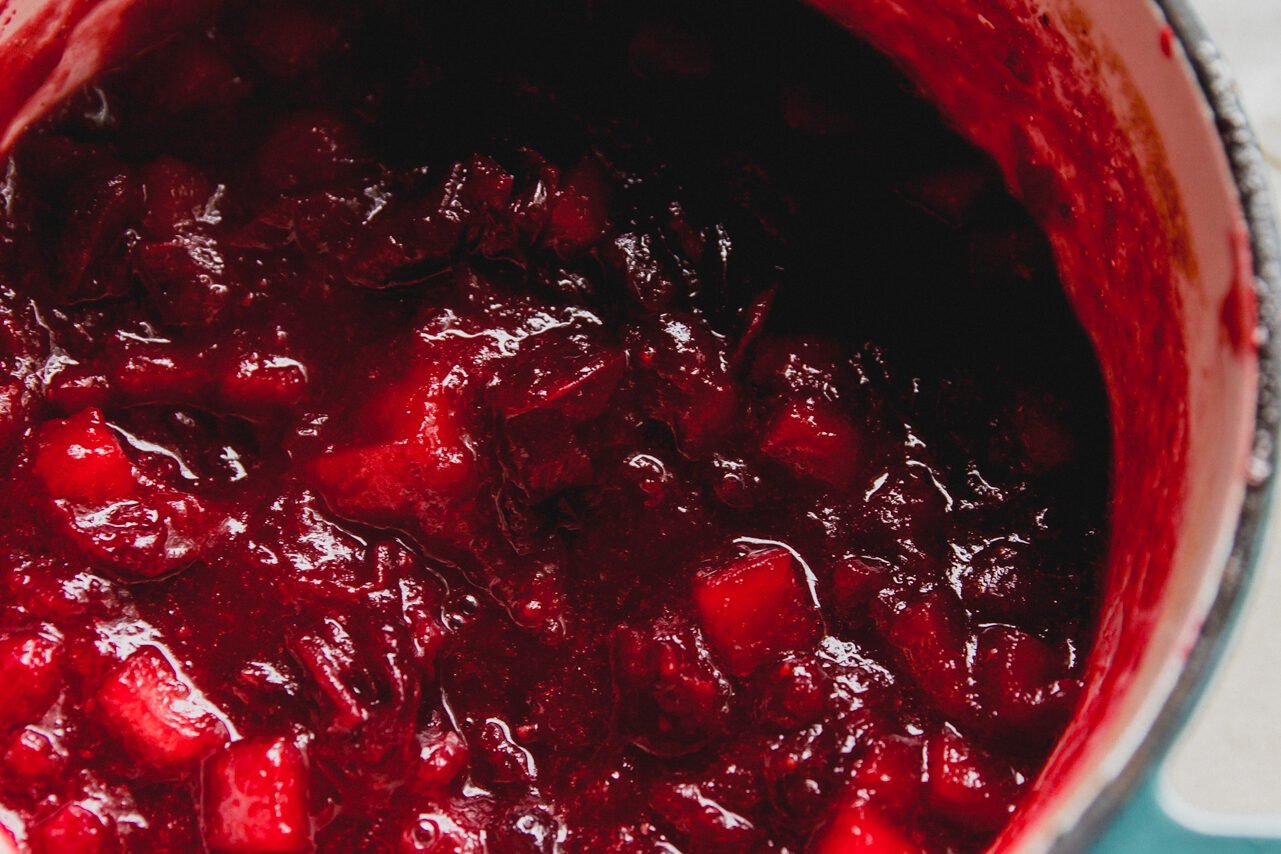 Apple cranberry sauce in a pot after being cooked.