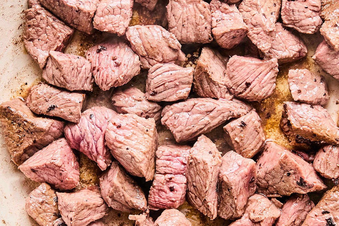 The beef browning in a skillet.