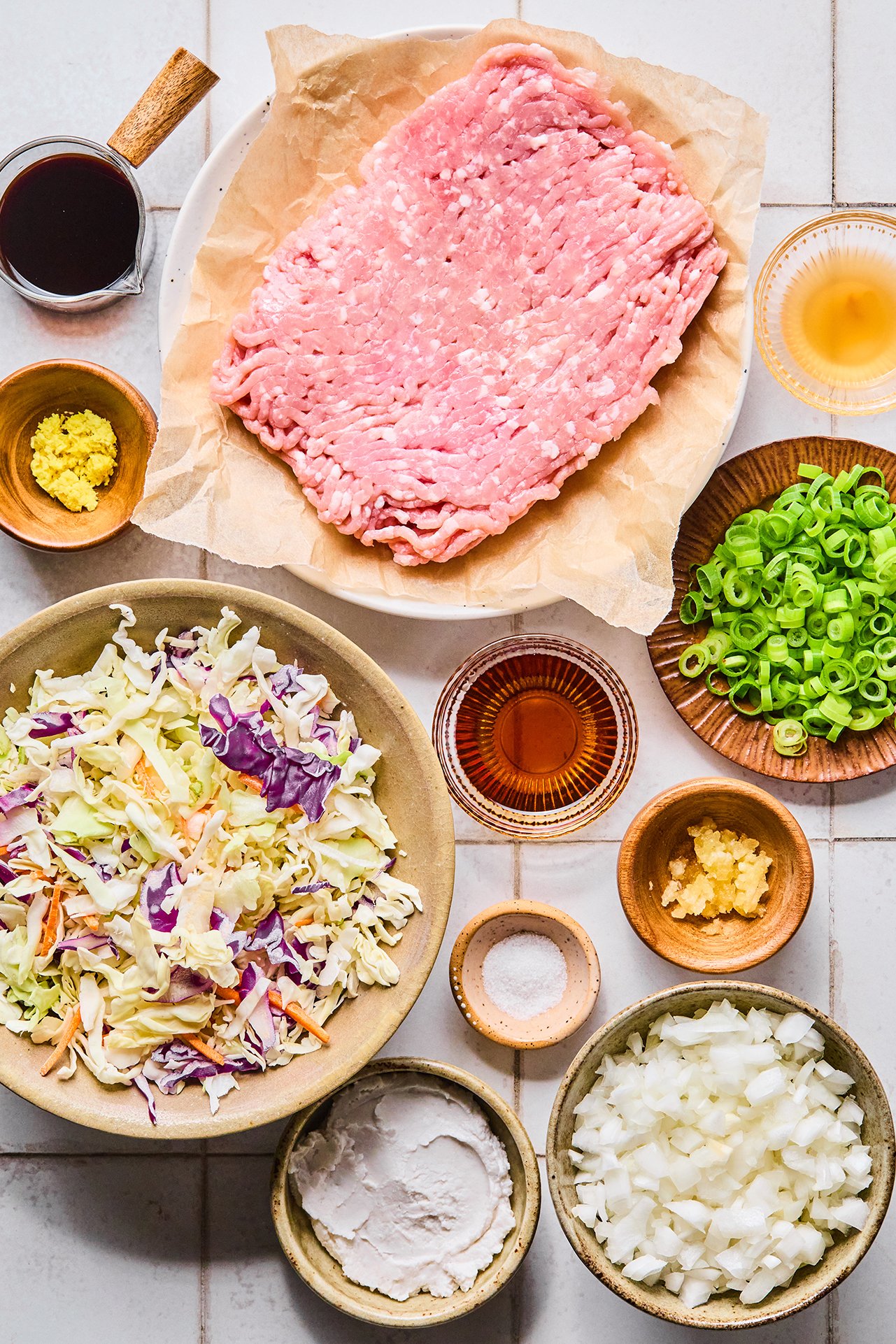 All the ingredients needed for Egg Roll in a Bowl out on the counter before beginning cooking.