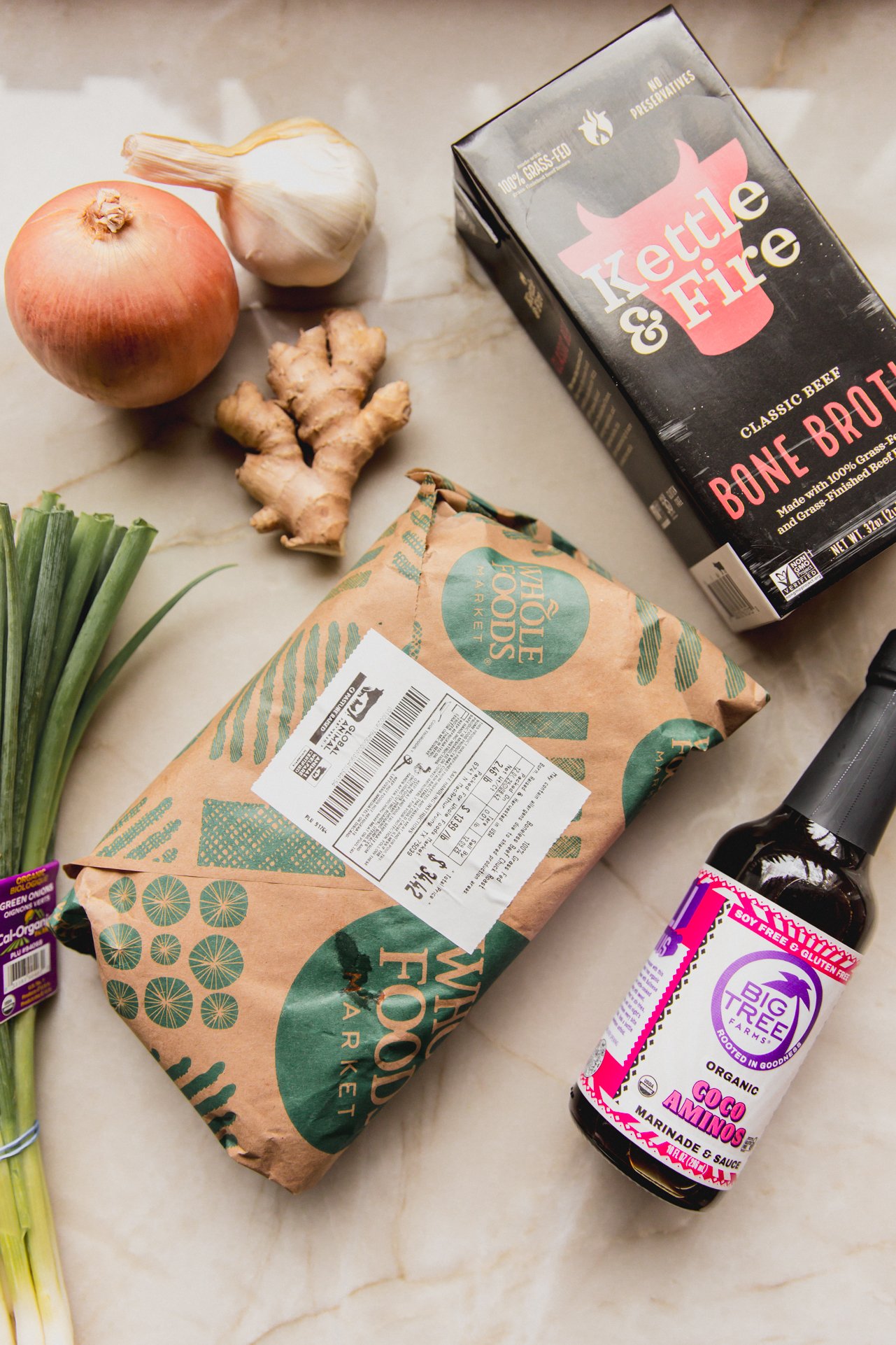 Ginger chuck roast ingredients laid out on a marble counter top.