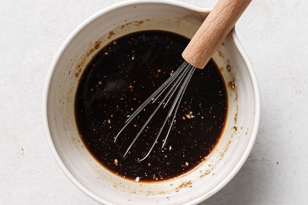 Teriyaki style sauce whisked together in a bowl.