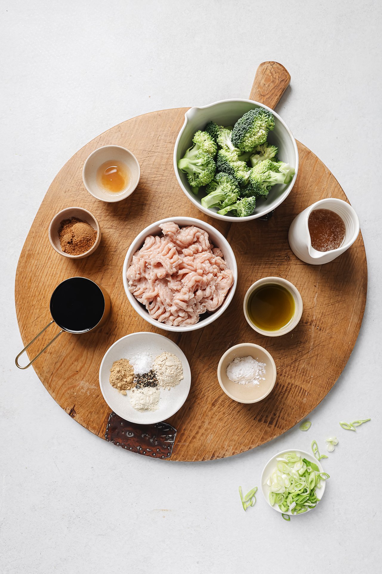 Ground chicken and broccoli ingredients in separate bowls.
