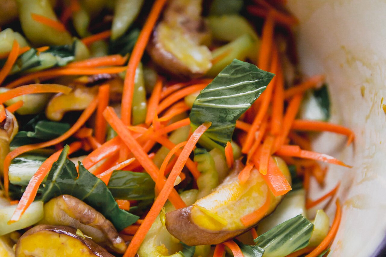 A close up image of the veggies sauting in a pan.