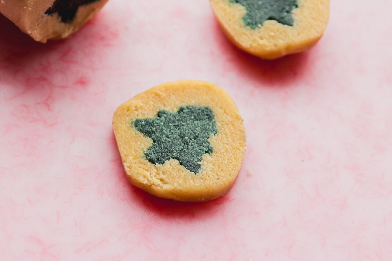 The slice and bake cookies with green christmas trees before baking.