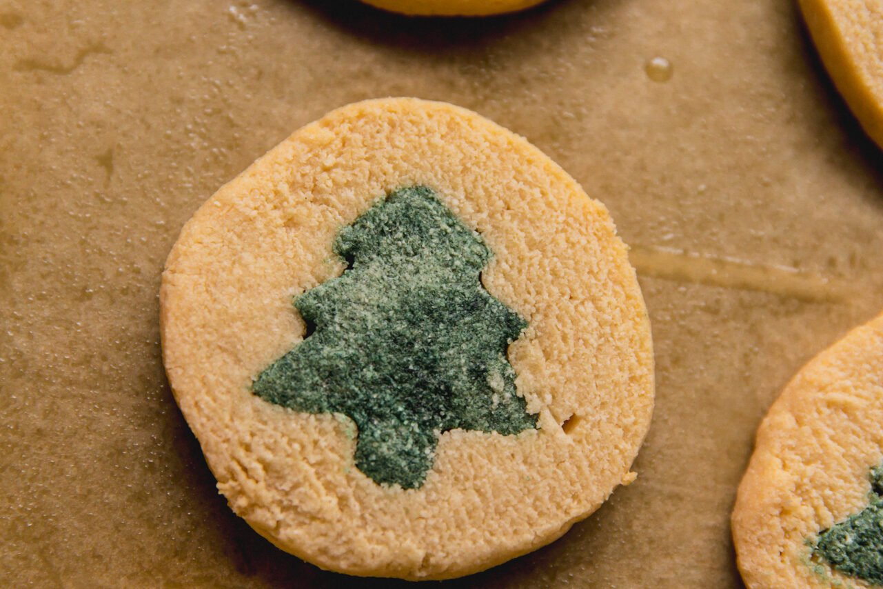 A slice and bake cookie with a christmas tree on it after baking