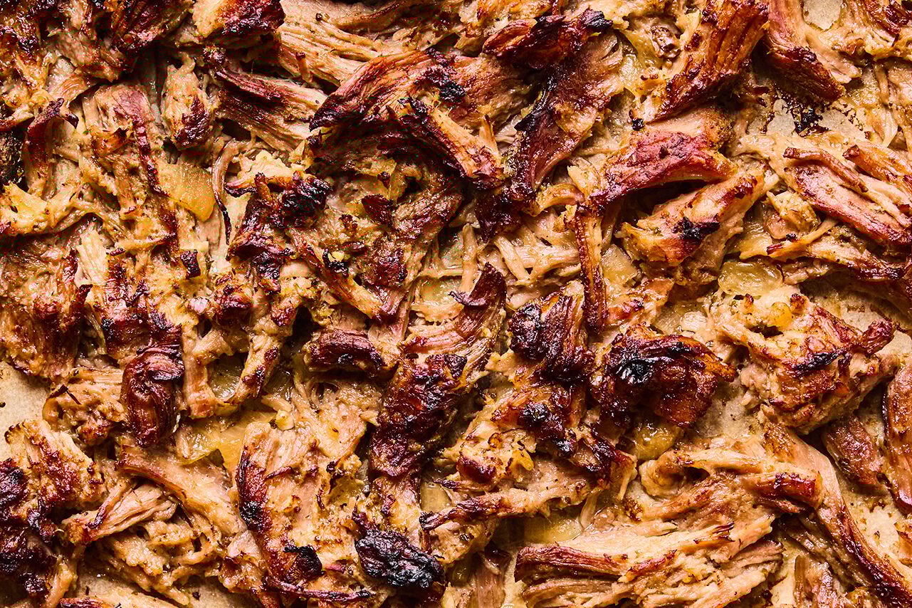 Crispy carnitas on a baking sheet.
