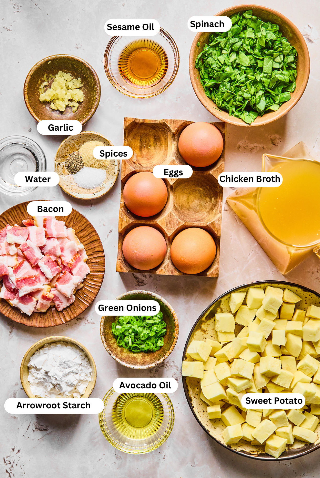 All the ingredients needed for breakfast egg drop soup in bowls before cooking begins.