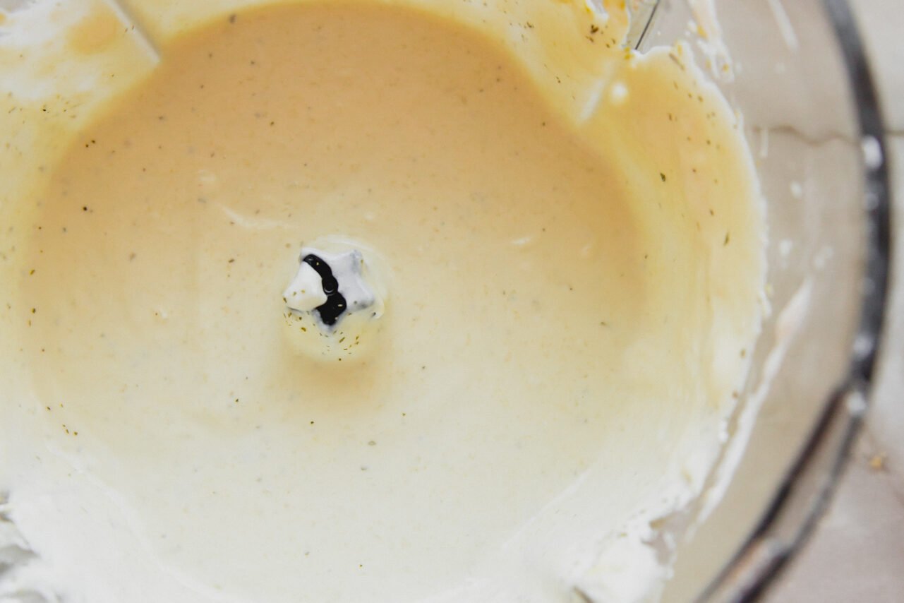 Coconut cream, coconut yogurt and cauliflower blended into a puree in a food processor.