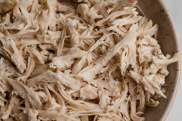 Shredded chicken in a bowl.