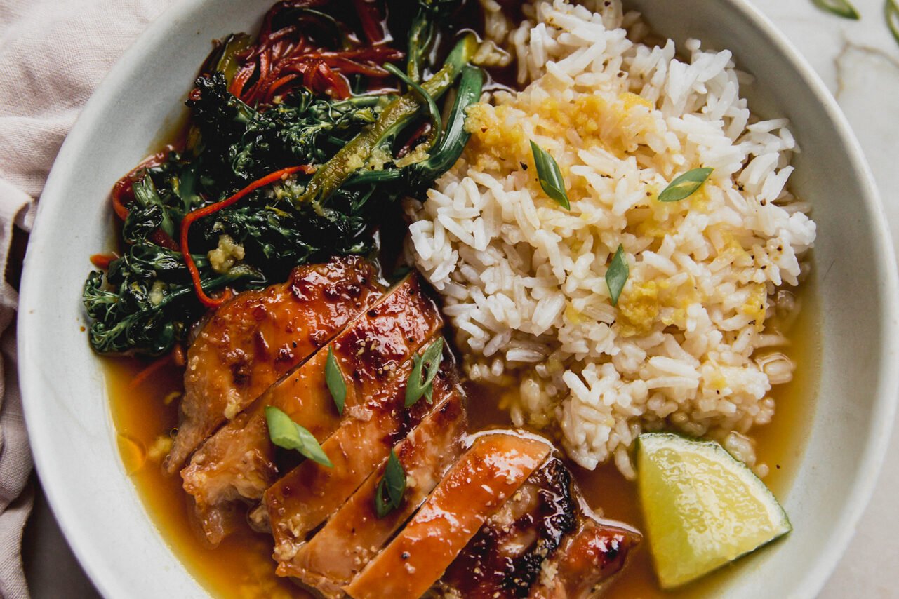 The brothy ginger chicken and rice bowl after being cooked and assembled.