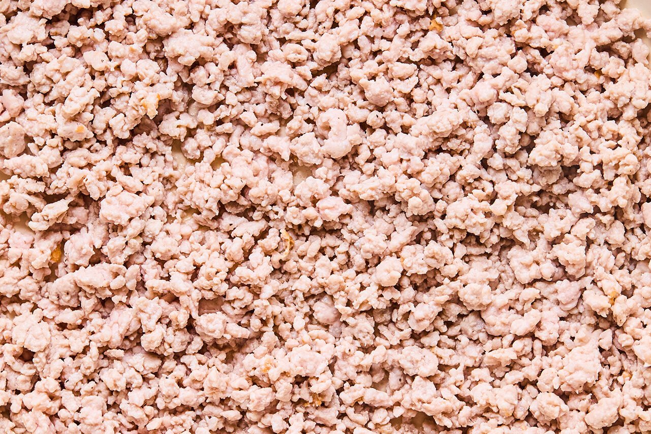 A skillet with ground pork browning in it.