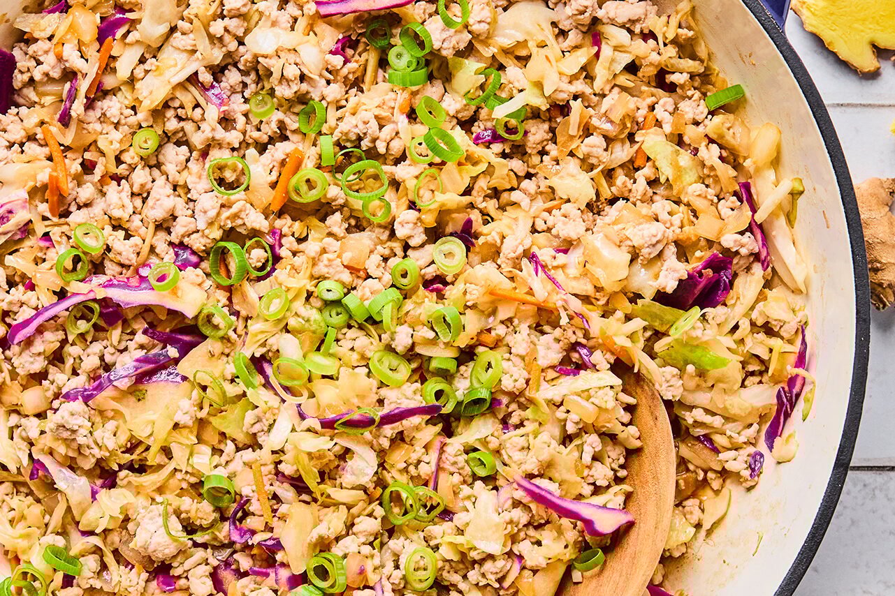The finished egg roll in a bowl toped with green onions ready to be enjoyed!