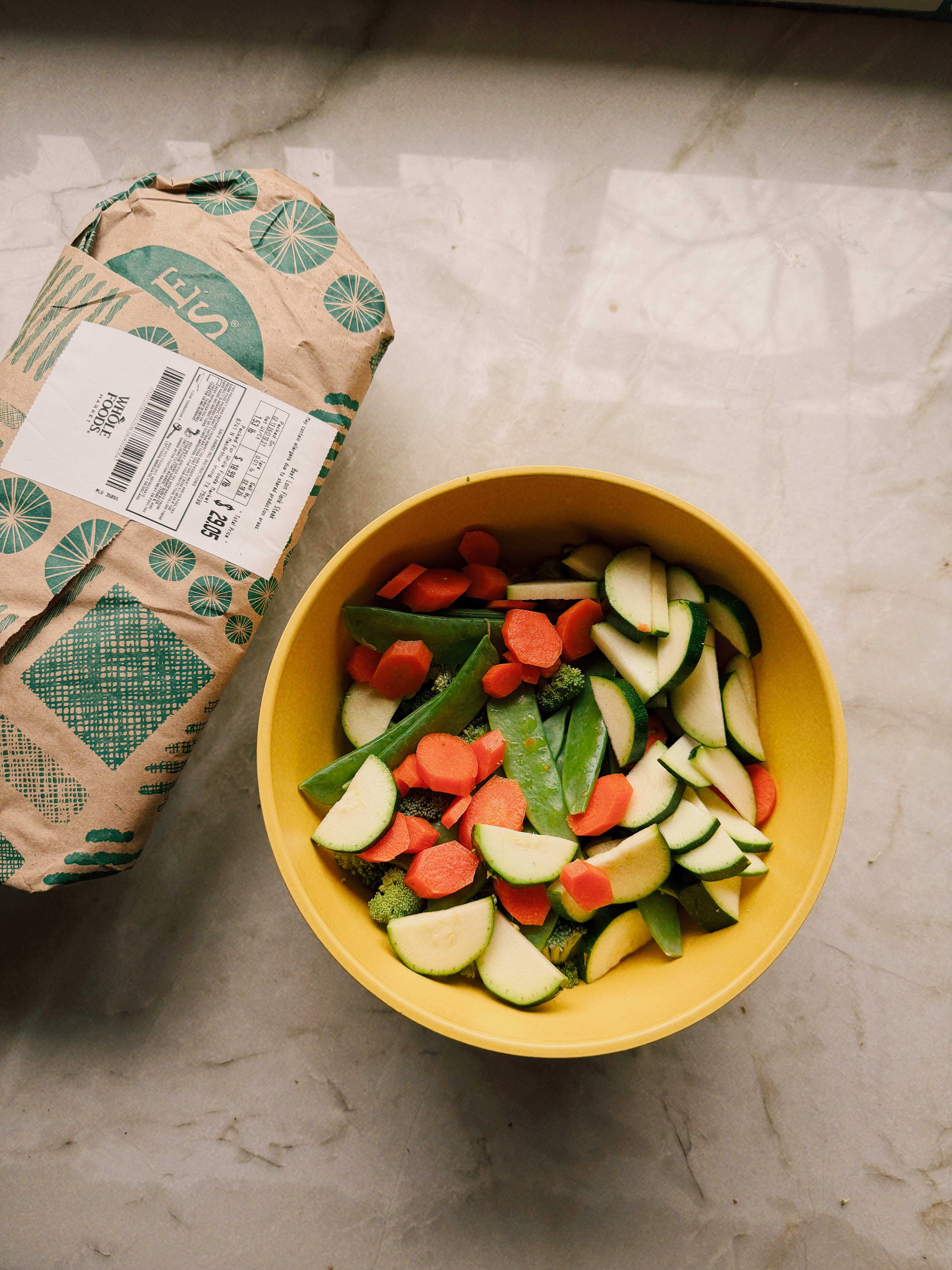 The ingredients needed for beef noodle stir fry on a counter before cooking begins.