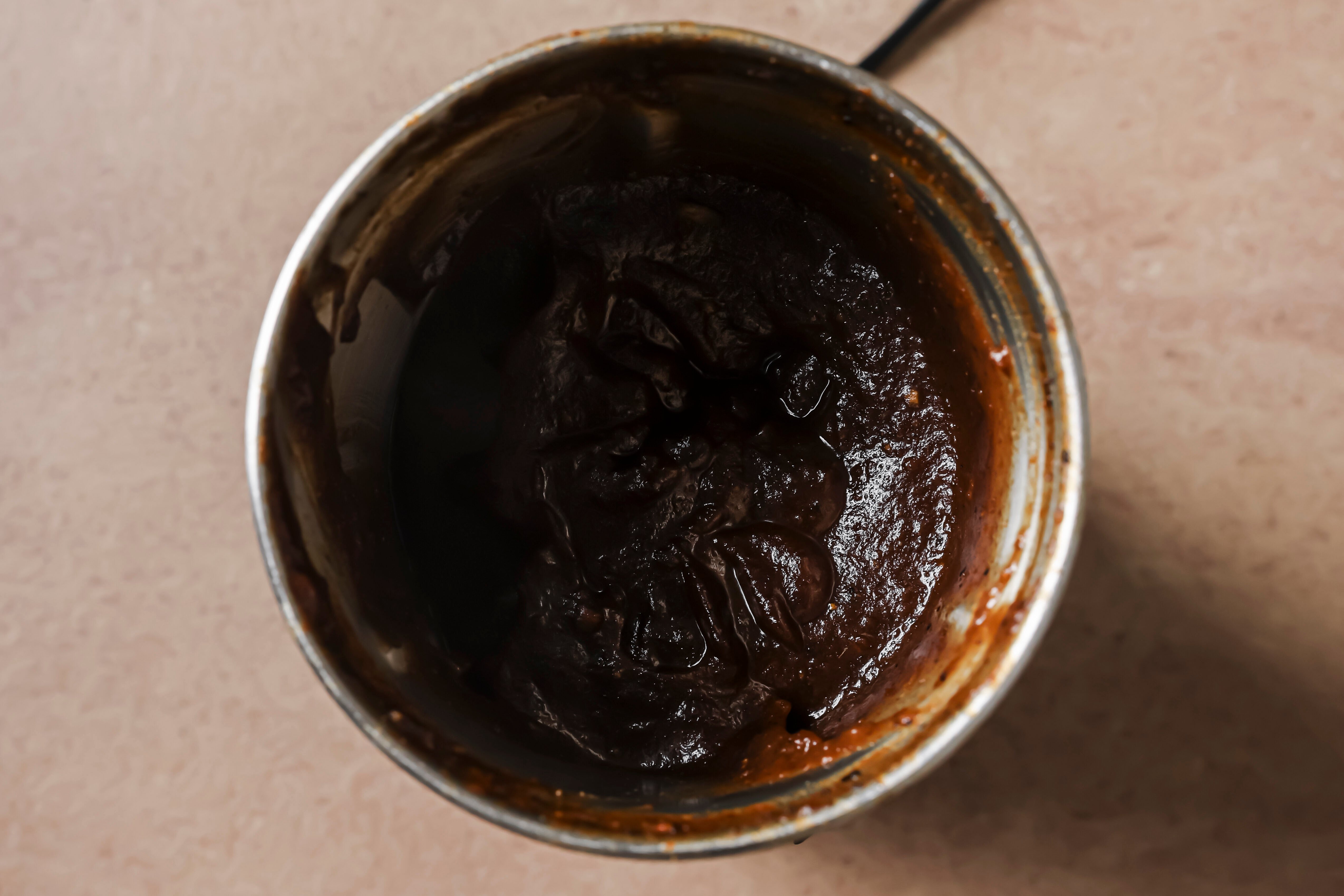 A pot with the hoisin sauce after cooking.