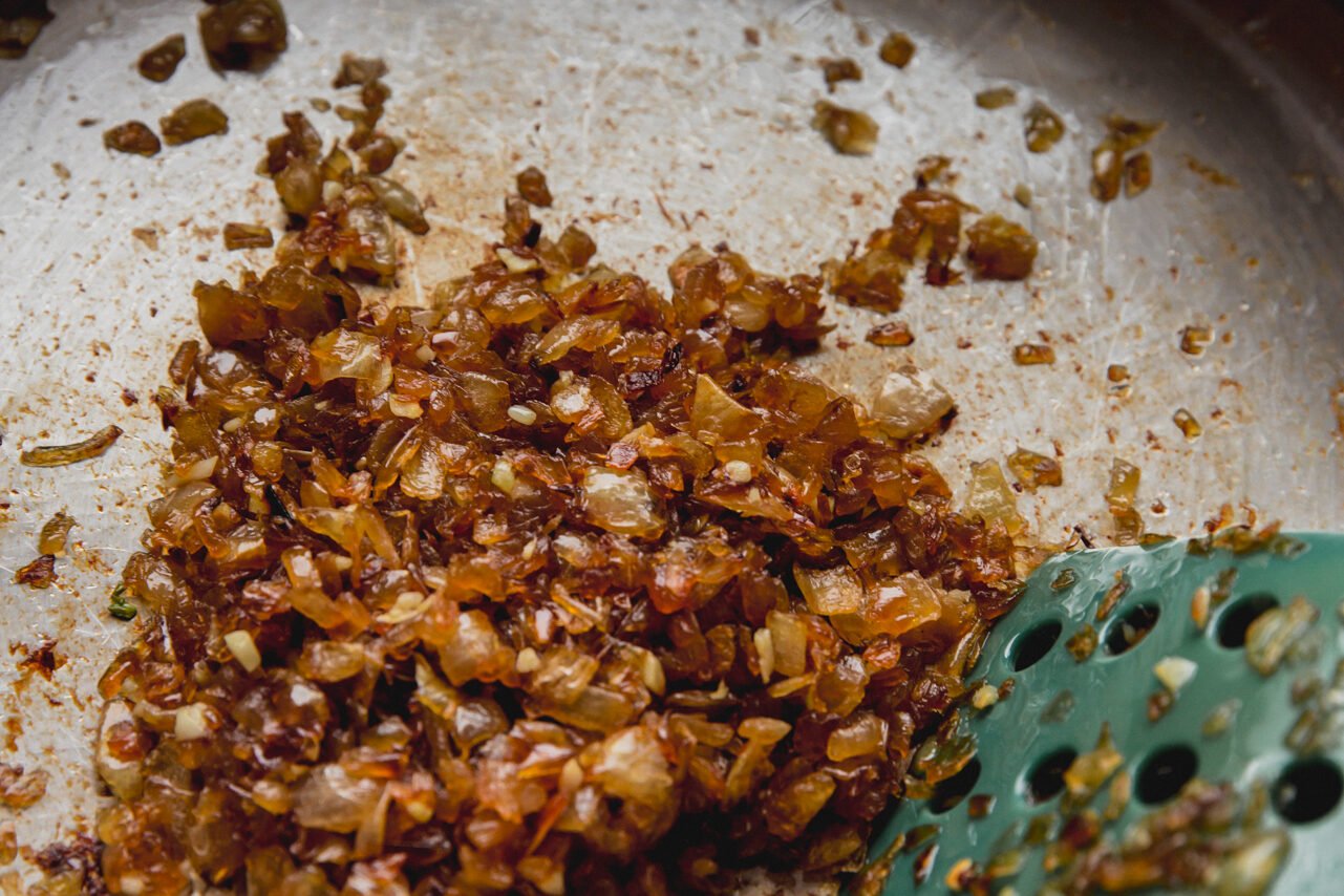 Onions and garlic caramelized in a pan after cooking.