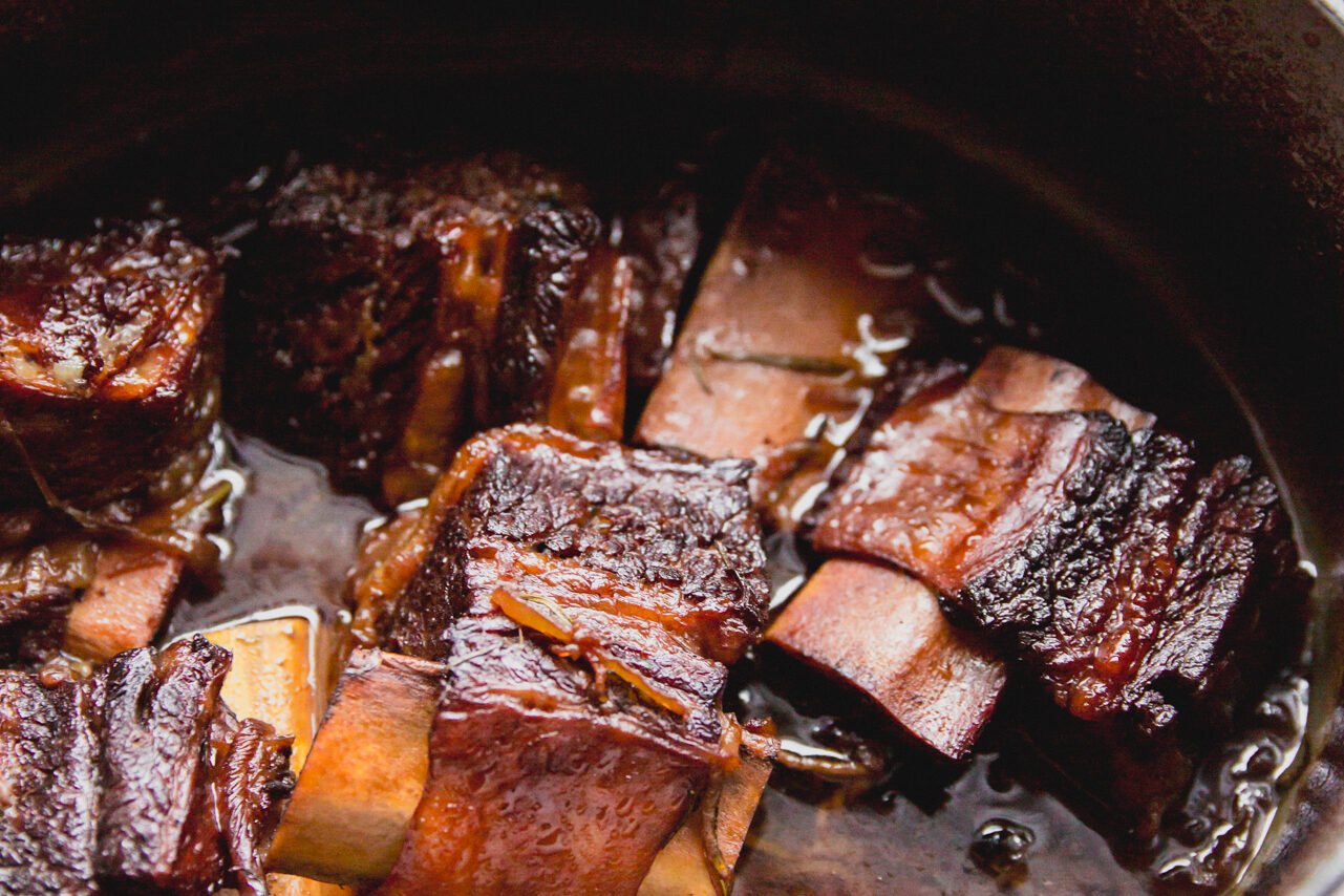 Short ribs in the Dutch oven after cooking.