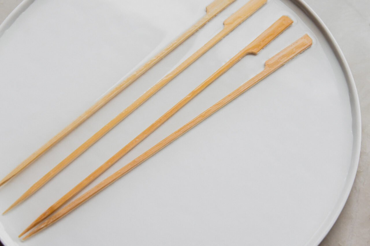 Bamboo skewers soaking in water.