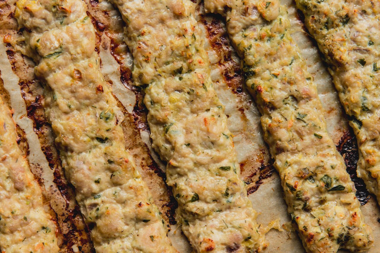 The kebabs on a baking sheet after baking.