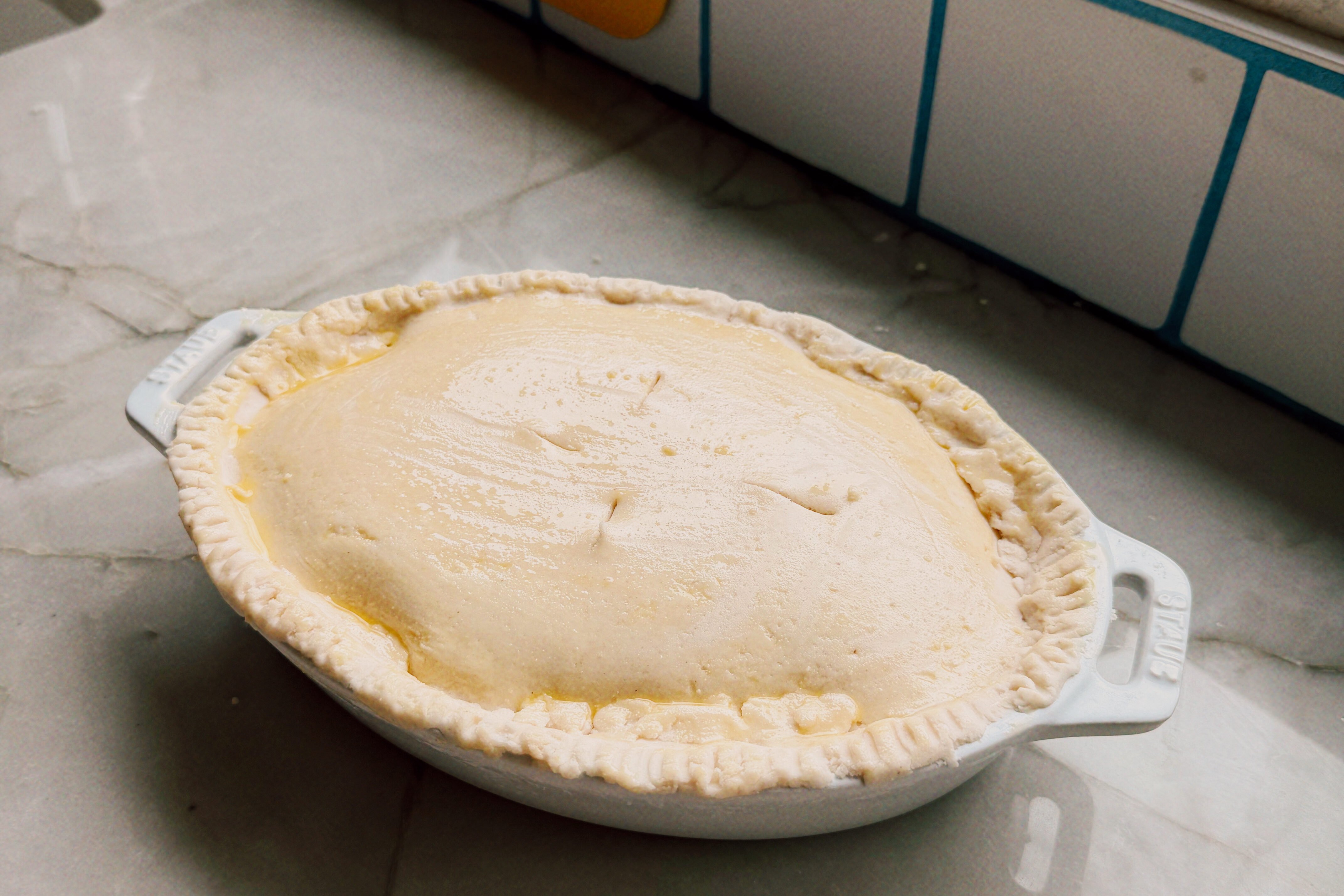 The beef pot pie after baking in the oven sitting on the counter before cutting into it.