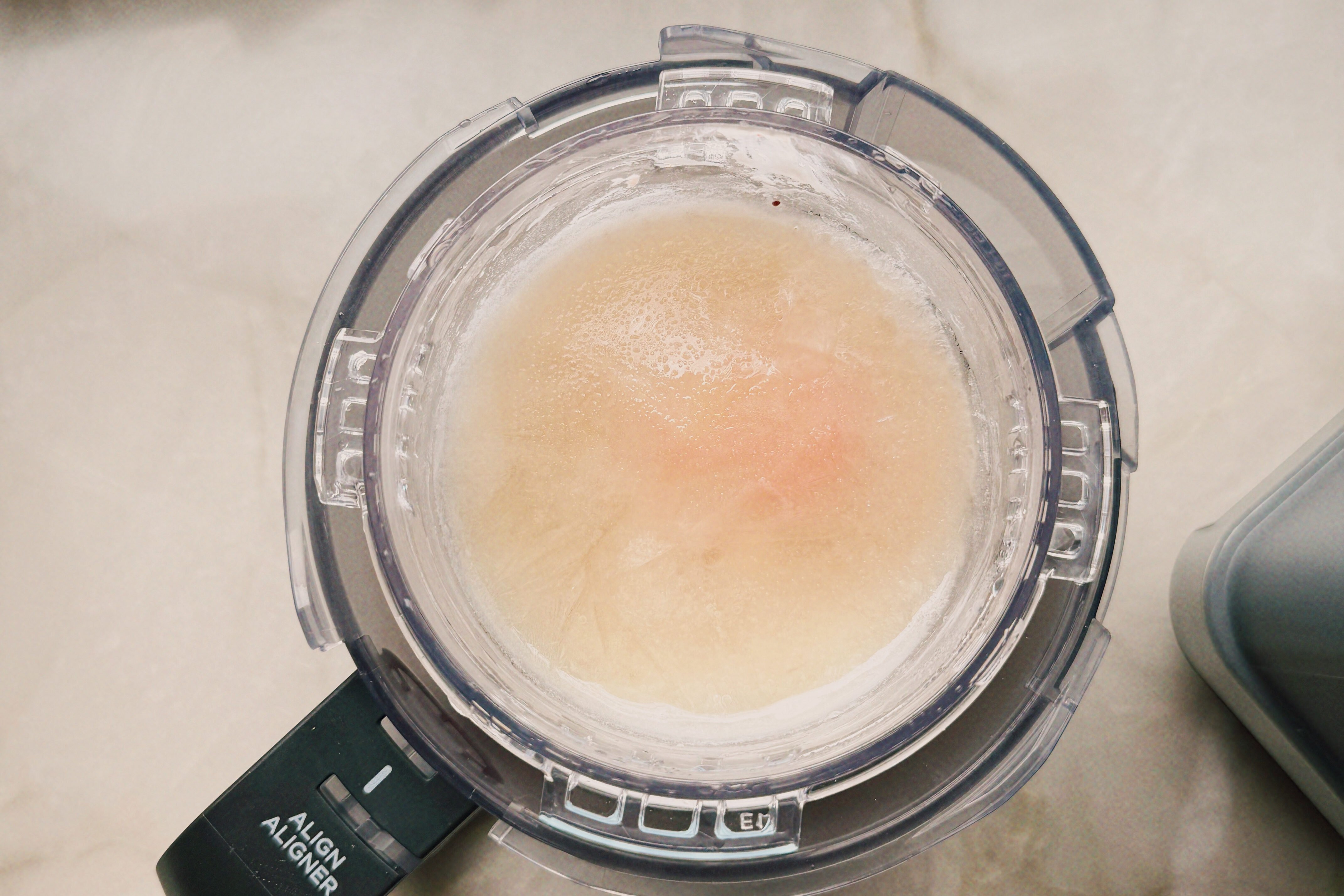 Strawberry ninja creami fully frozen in the ninja creami pint container.