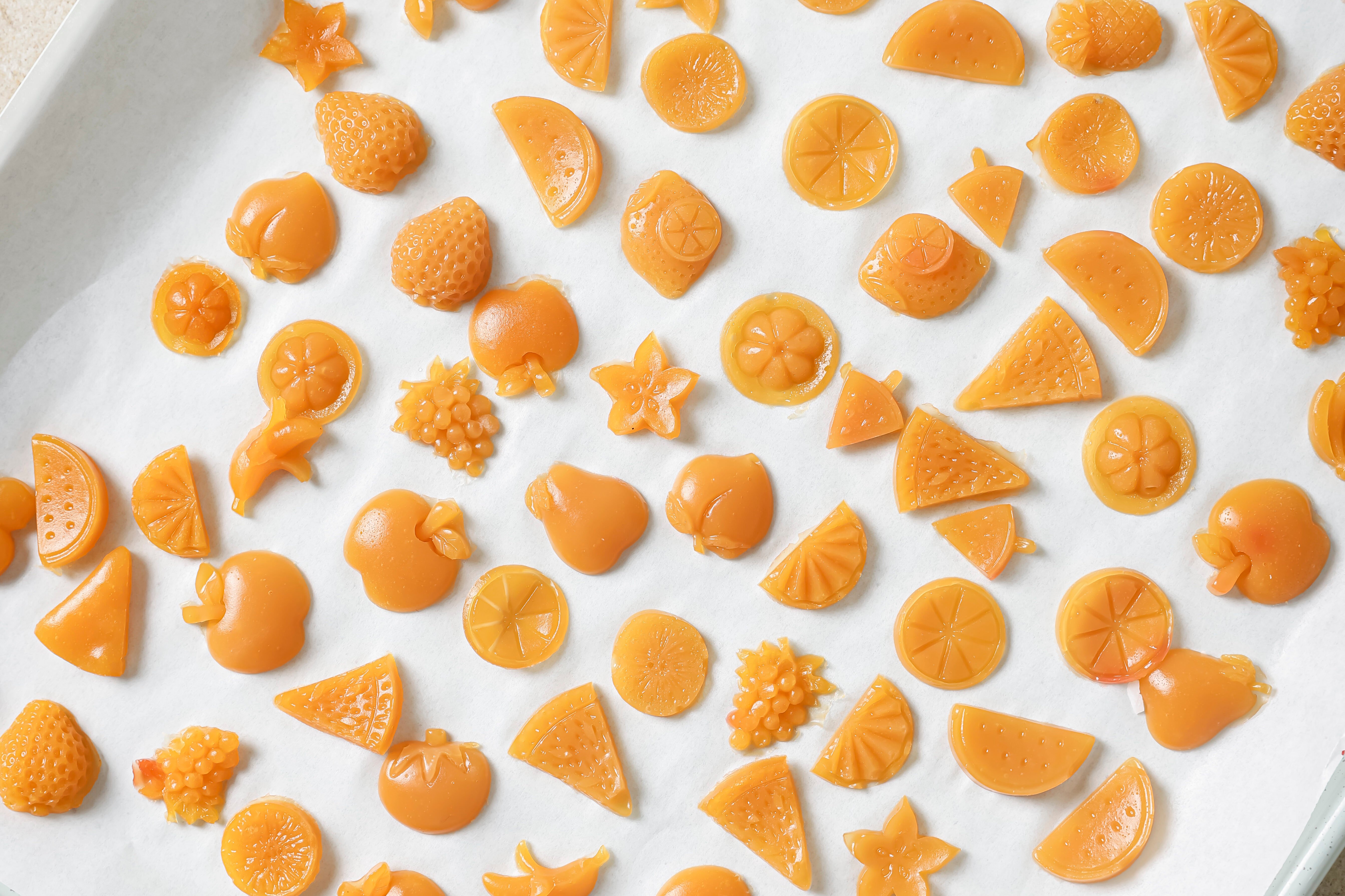 A white platter filled with homemade fruit snacks after they have been removed from the molds.
