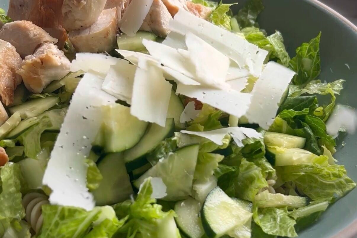Chicken pasta salad ingredients in a bowl