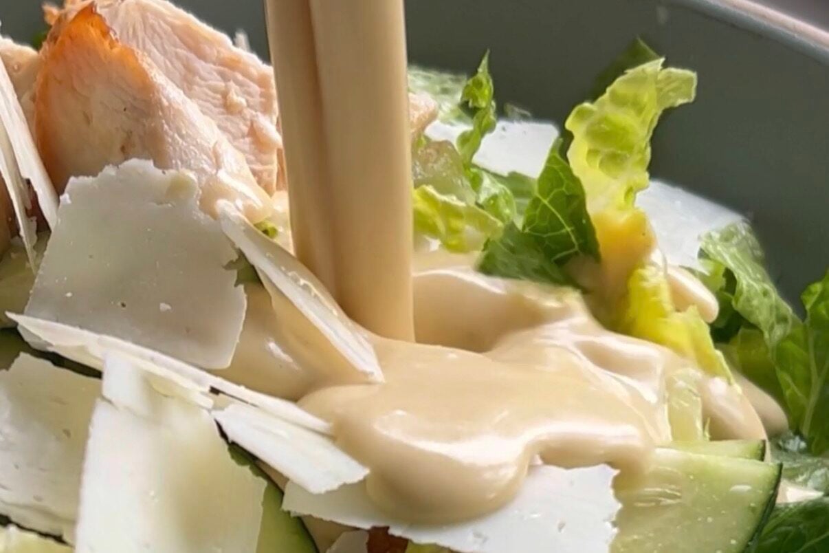 Dressing pouring over salad.