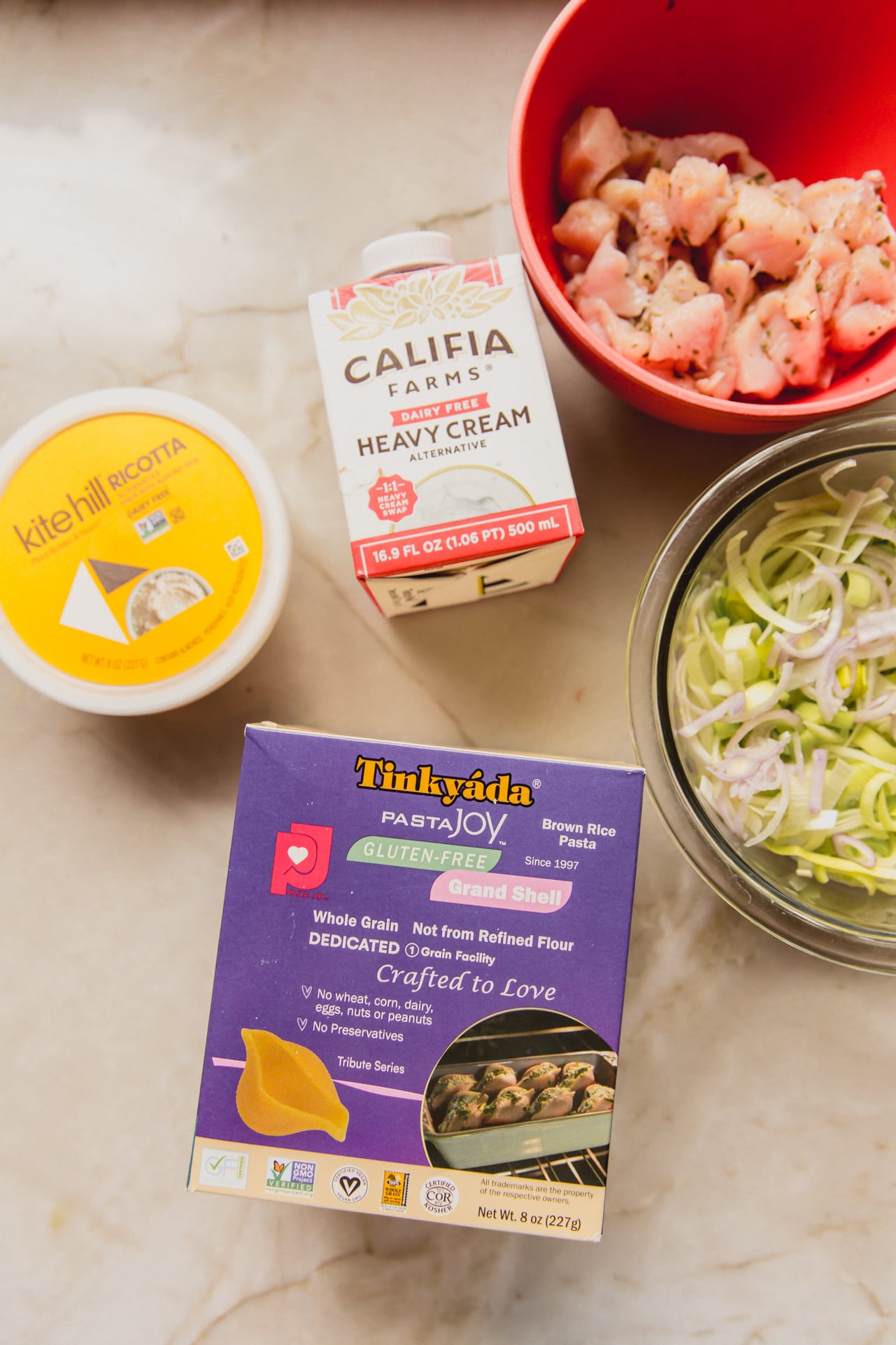 The main ingredients for making creamy chicken stuffed shells.