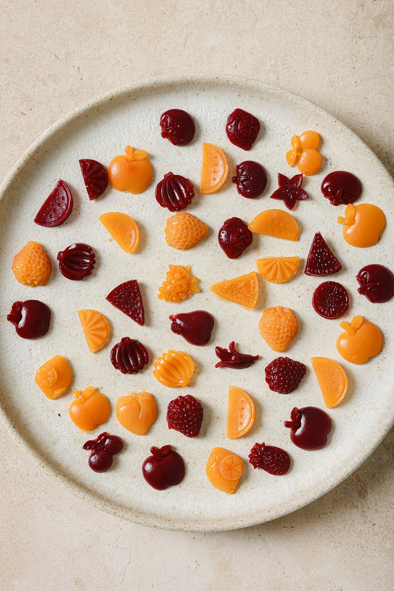 A white plate with homemade fruit snacks on it.