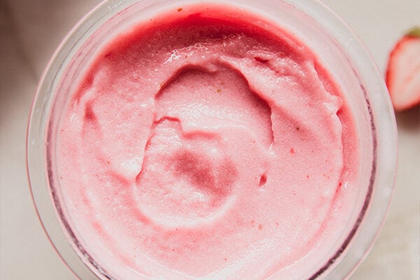 Strawberry pink drink sorbet, fully blended in a ninja creami container.