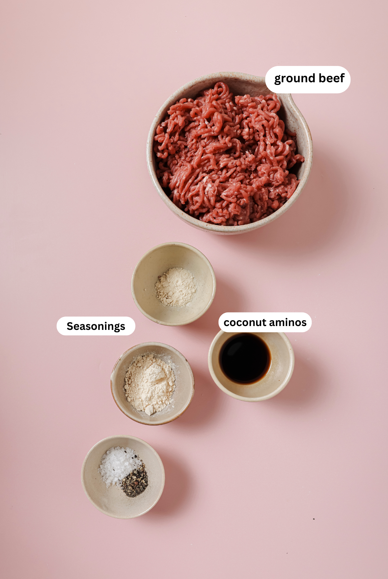 Air fryer burger ingredients in bowls.