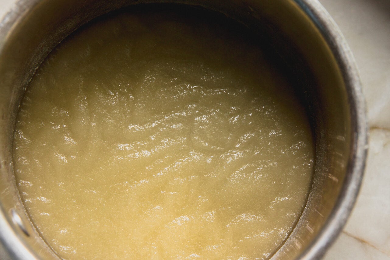 A pot filled with pickle gelatin mixture that is not liquid yet.