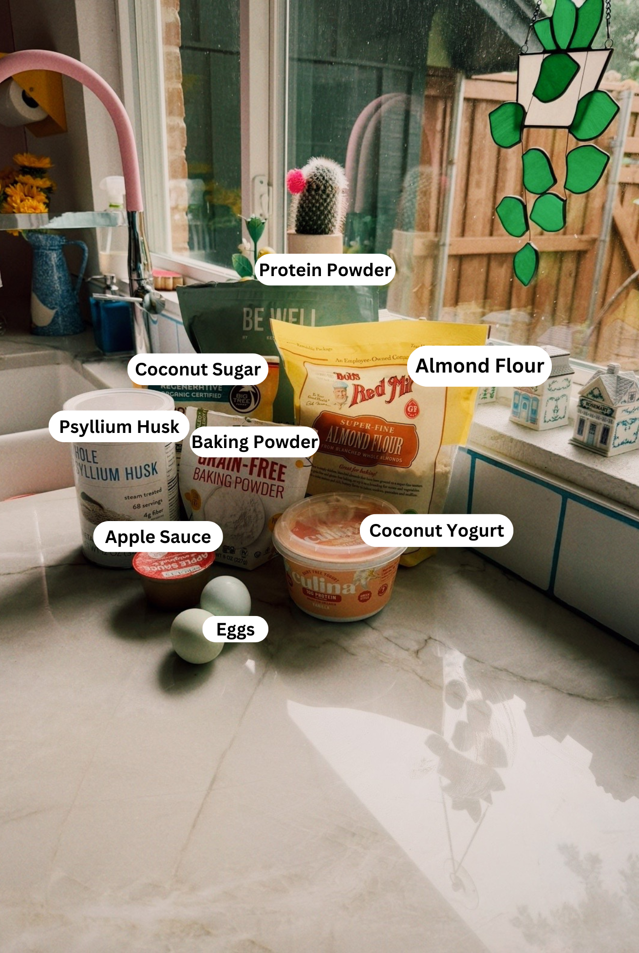 The ingredients to make high protein muffins on a counter before baking begins.