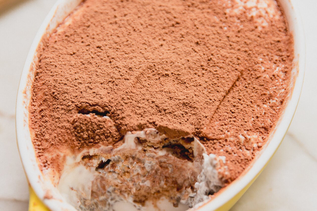 Protein tiramisu in a small yellow dish.