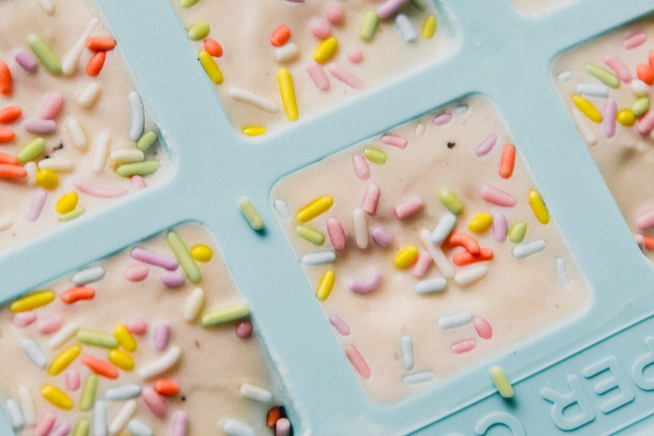 The finished ice cream cake bites after sprinkles added and frozen solid before being removed from the mold.